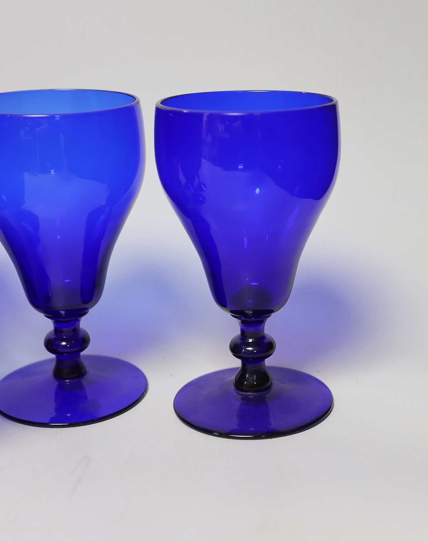 A set of five Bristol blue glasses and three others